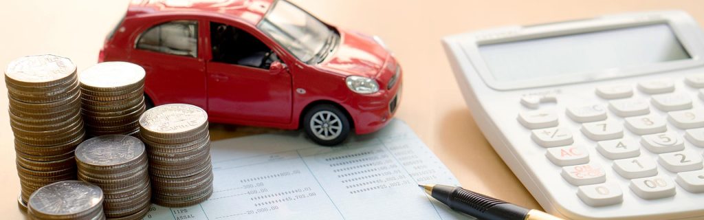 Toy car with coins and a calculator.