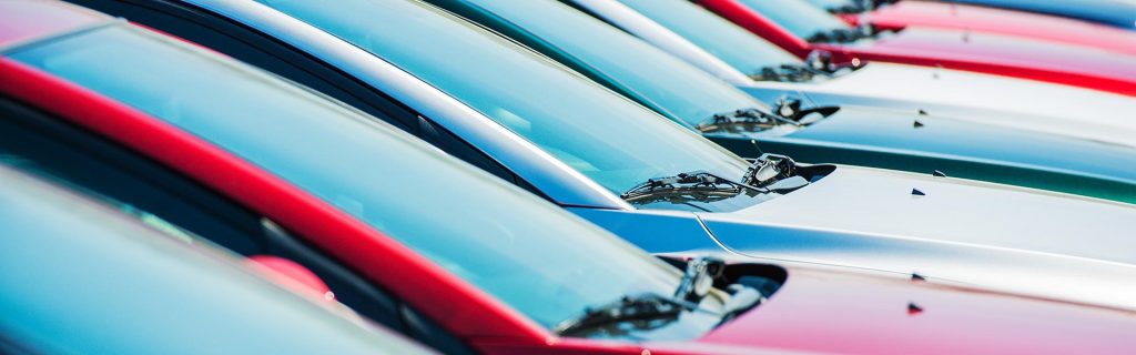 Row of colorful parked cars.